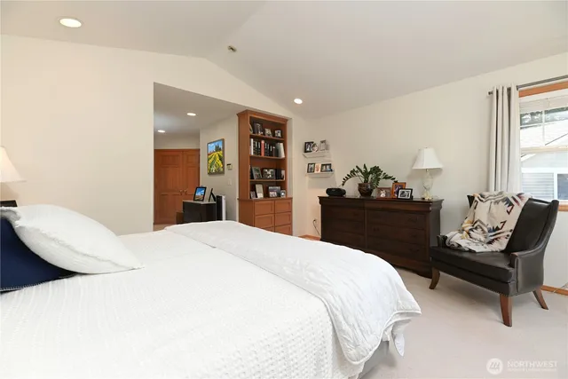 a bedroom with a bed and dresser