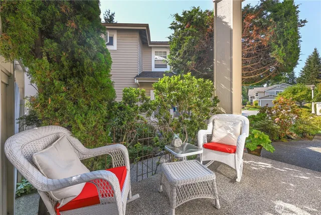 a backyard of a house with outdoor seating