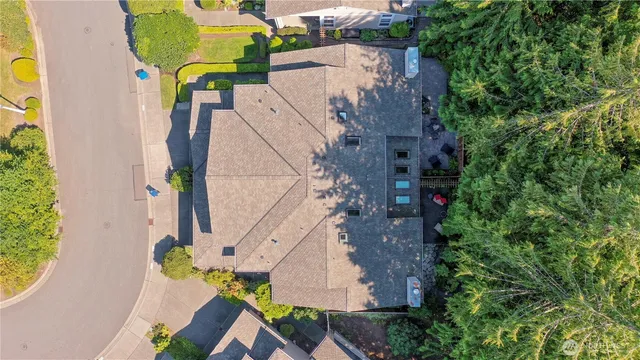 an aerial view of a house with swimming pool