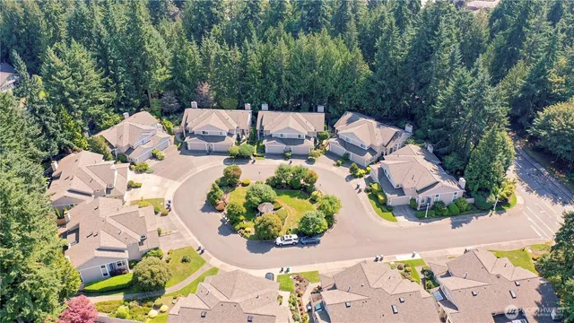 an aerial view of a house with outdoor space