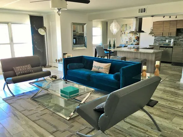 a living room with furniture and a large window