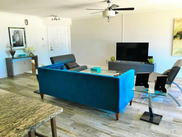 a view of a dining room with furniture and wooden floor