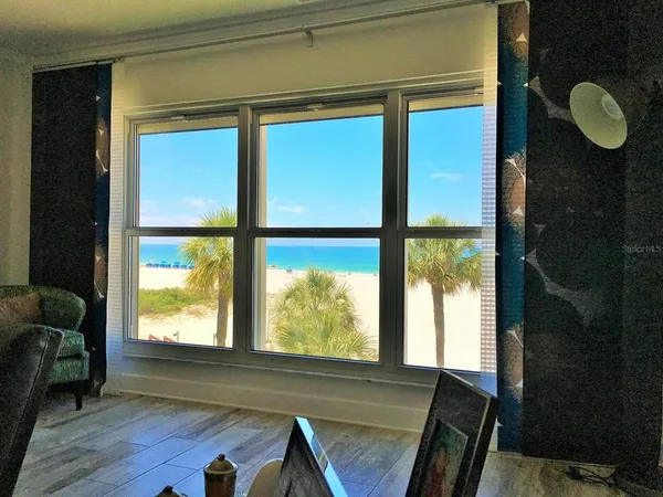 a dining room with furniture window and potted plant on the table