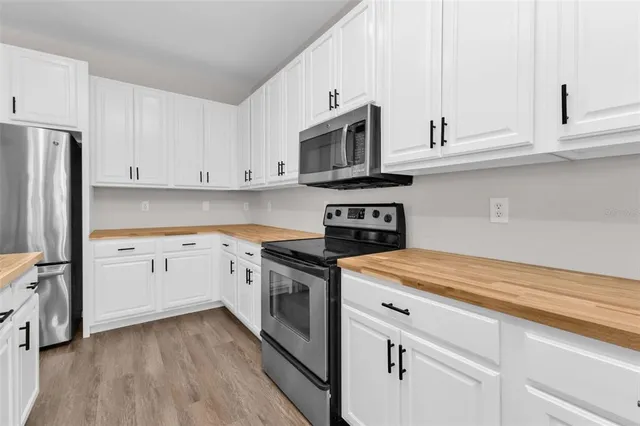 a white bath tub sitting next to a white sink