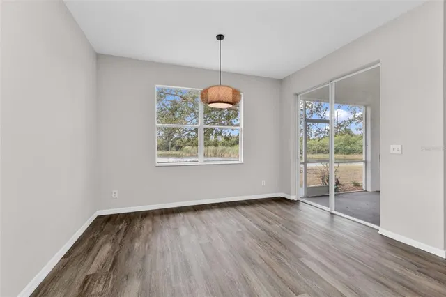 a white bath tub sitting next to a shower