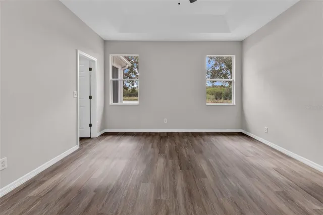 a view of a house with swimming pool and sitting area