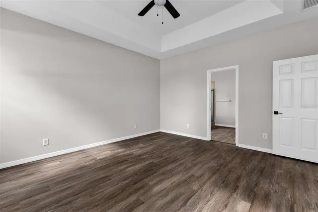 an aerial view of residential houses with outdoor space and lake view
