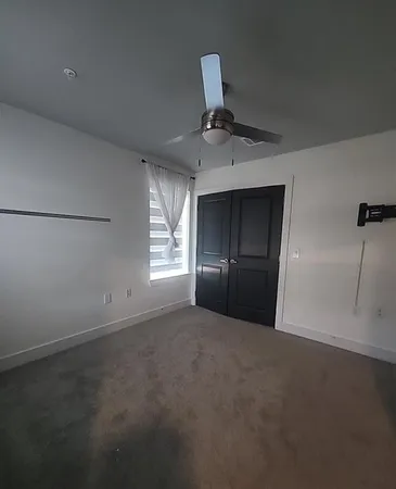 a view of an empty room and window