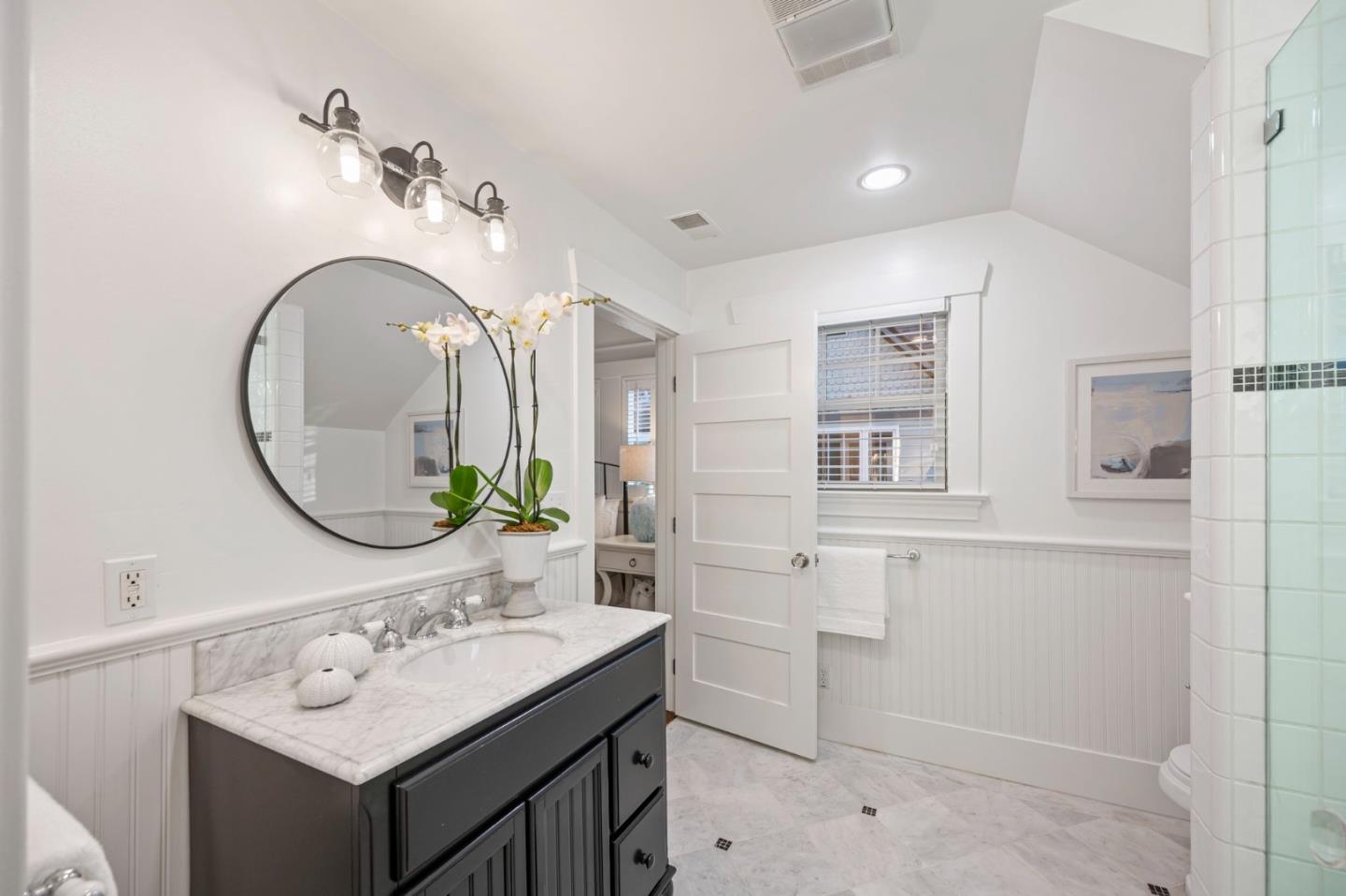 445 Arlington Road Redwood City, CA 94062 - Photo 23 of 50 a bathroom with a sink and a mirror