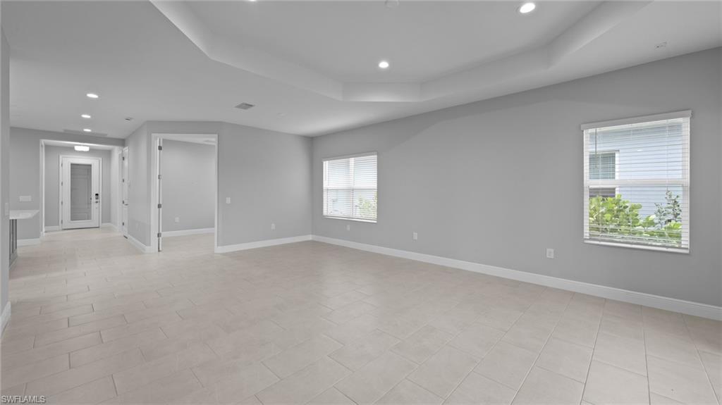 4636 Skysail Drive Naples, FL 34120 - Photo 14 of 46 a view of an empty room with a window