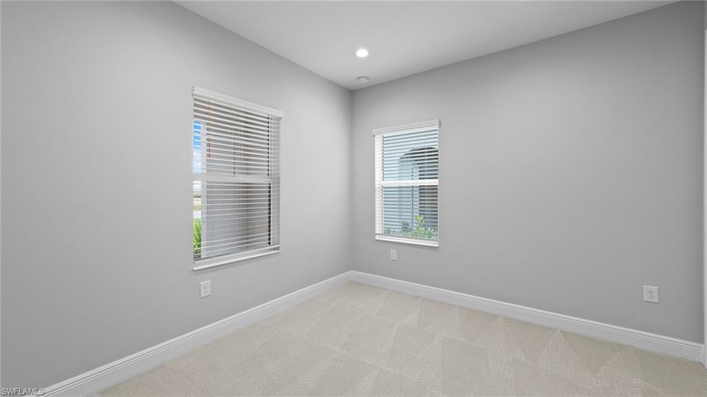 4636 Skysail Drive Naples, FL 34120 - Photo 15 of 46 an empty room with a window