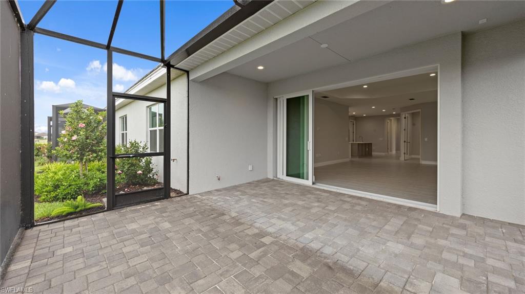 4636 Skysail Drive Naples, FL 34120 - Photo 32 of 46 a view of an empty room and glass door