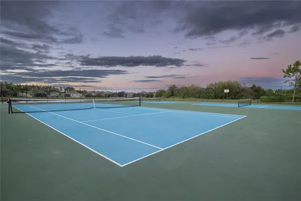 a view of an outdoor space and tennis court