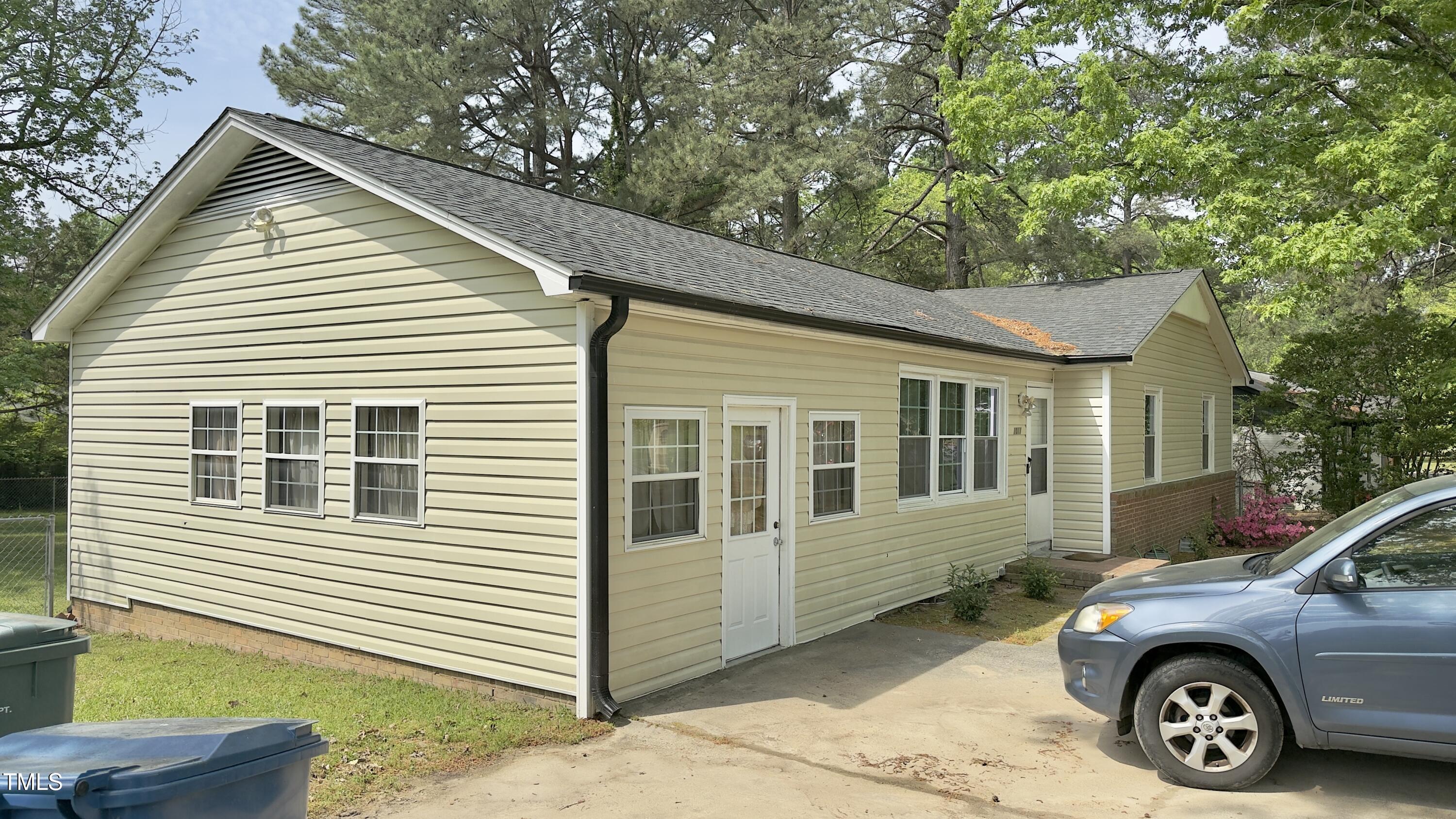 1011 Wyldewood Road Durham, NC 27704 - Photo 2 of 18 a car parked in front of a house