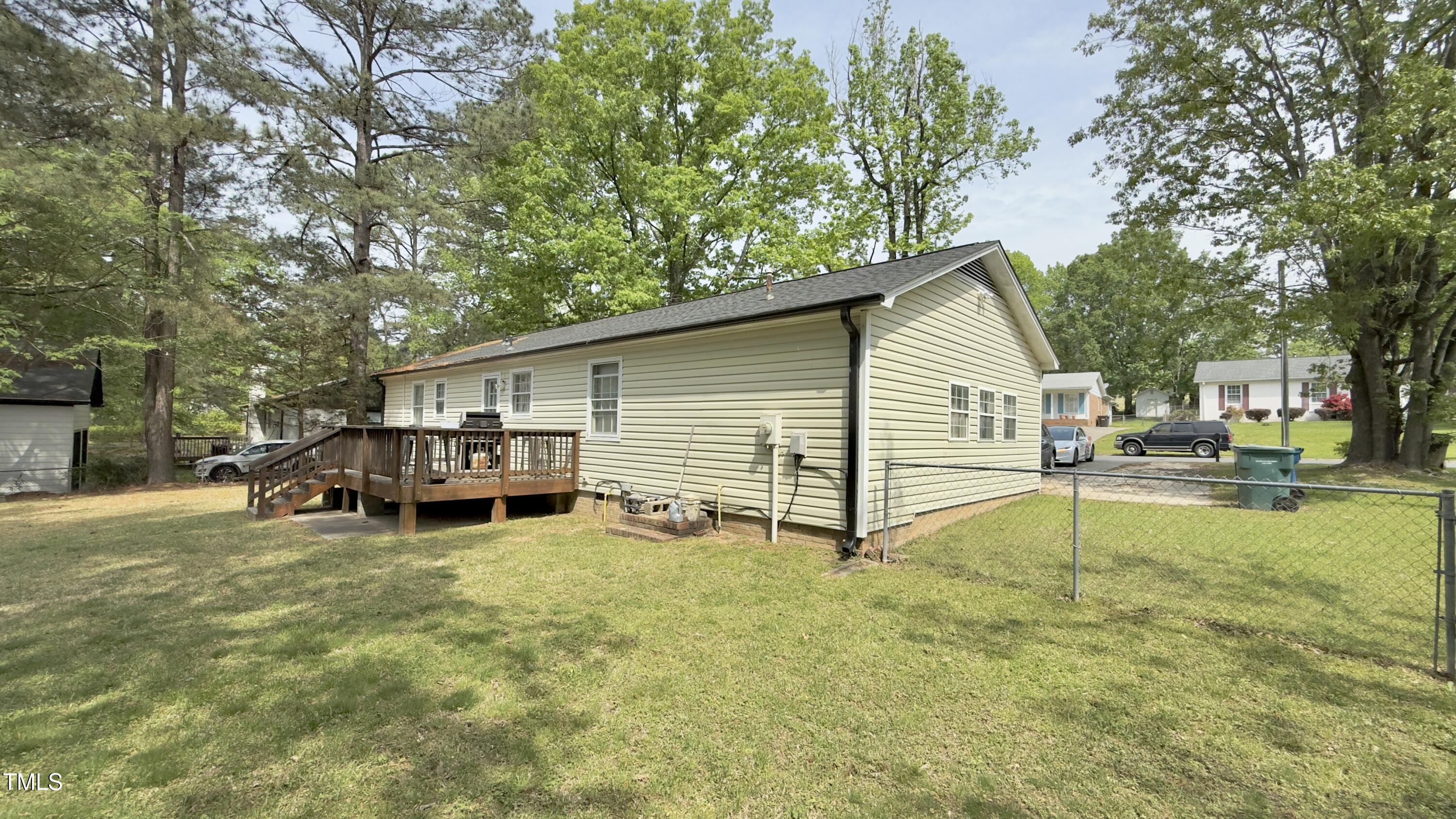 1011 Wyldewood Road Durham, NC 27704 - Photo 3 of 18 a view of a house with swimming pool and sitting area