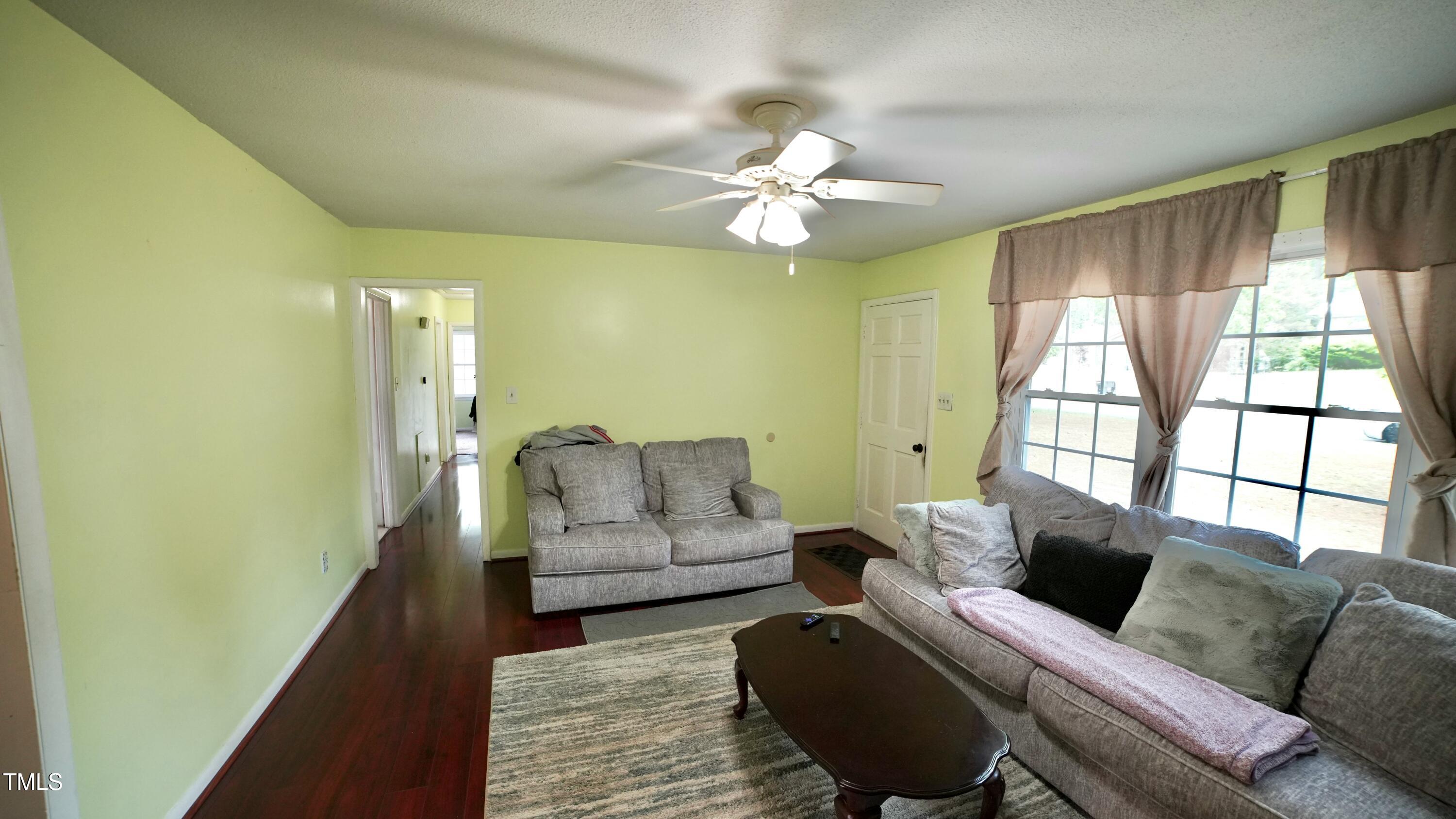1011 Wyldewood Road Durham, NC 27704 - Photo 6 of 18 a living room with furniture and a large window