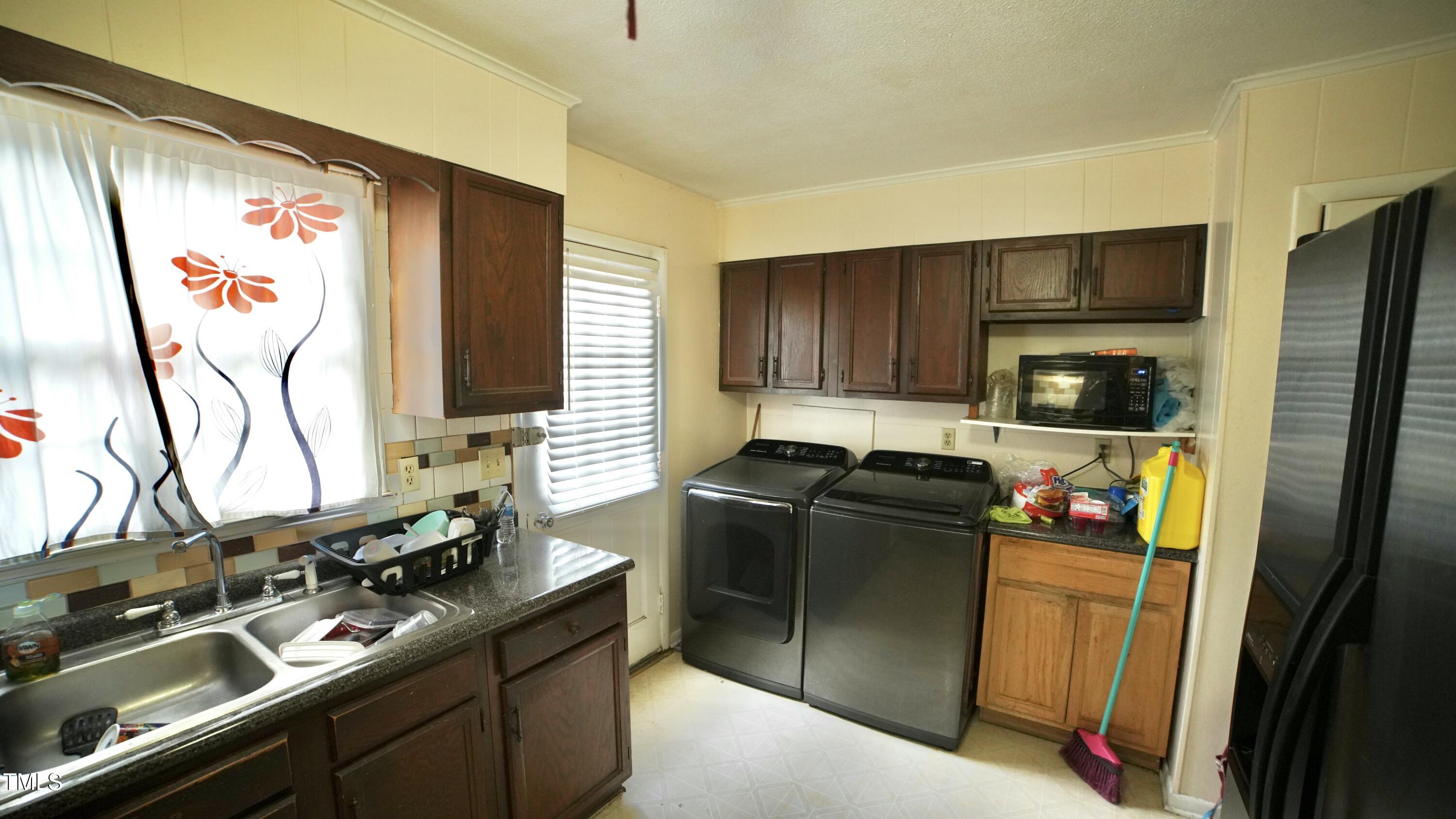 1011 Wyldewood Road Durham, NC 27704 - Photo 8 of 18 a kitchen with stainless steel appliances granite countertop a refrigerator and a stove