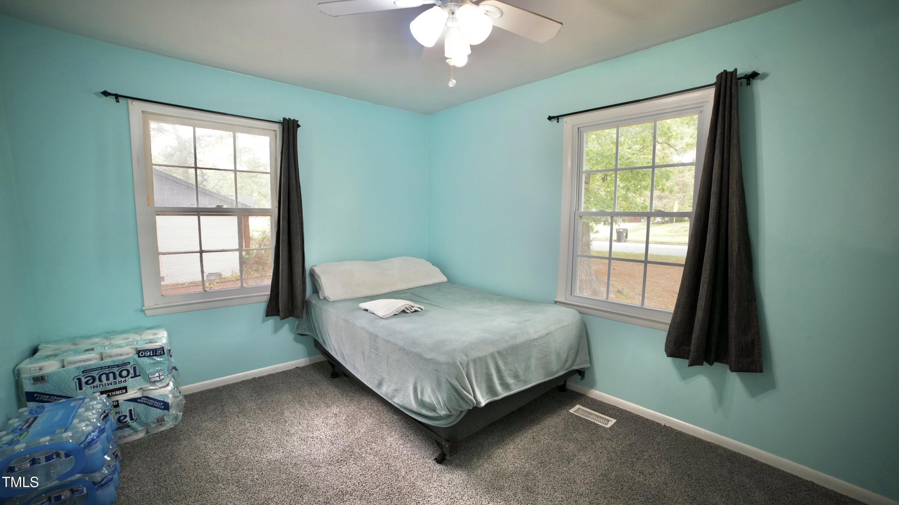 1011 Wyldewood Road Durham, NC 27704 - Photo 9 of 18 a bedroom with a bed and a window