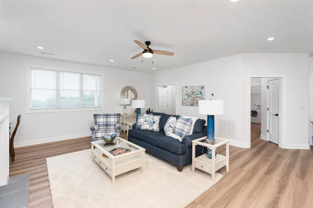 a view of dining room and chairs with wooden floor