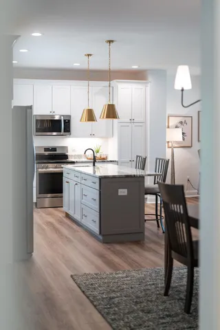 a bedroom with a bed and a dresser