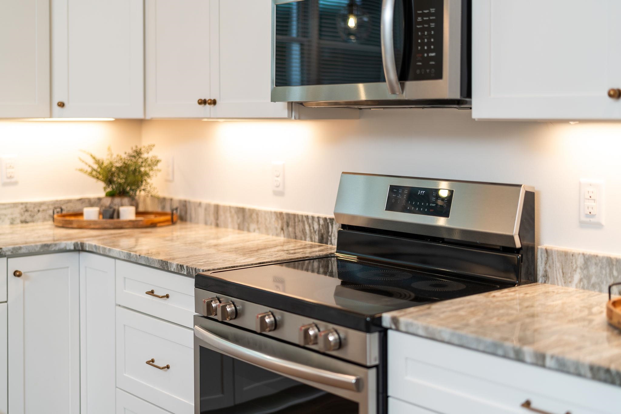 Tbd Wrights Way Staunton, VA 24401 - Photo 29 of 75 a kitchen with granite countertop a stove and white cabinets