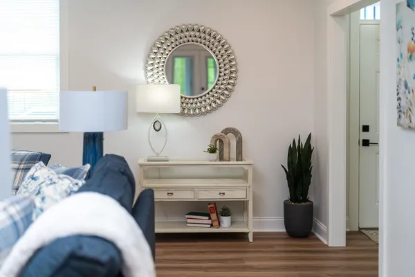 a living room with furniture and a fireplace