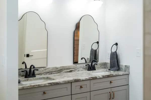 a view of a bathroom with a washing machine with wooden floor