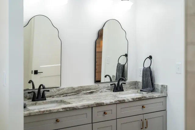 a view of a bathroom with a washing machine with wooden floor
