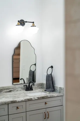 a view of swimming pool with seating area and trees in the background