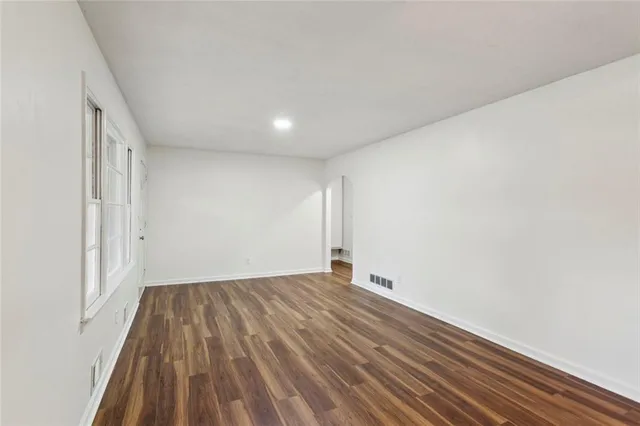 a view of room with wooden floor