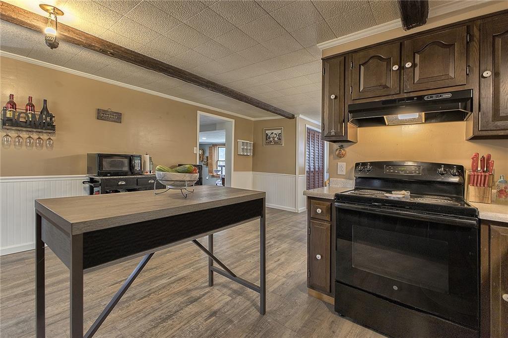3456 Country Club Road Mount Pleasant, PA 15666 - Photo 20 of 39 a kitchen with stainless steel appliances granite countertop a stove and a sink