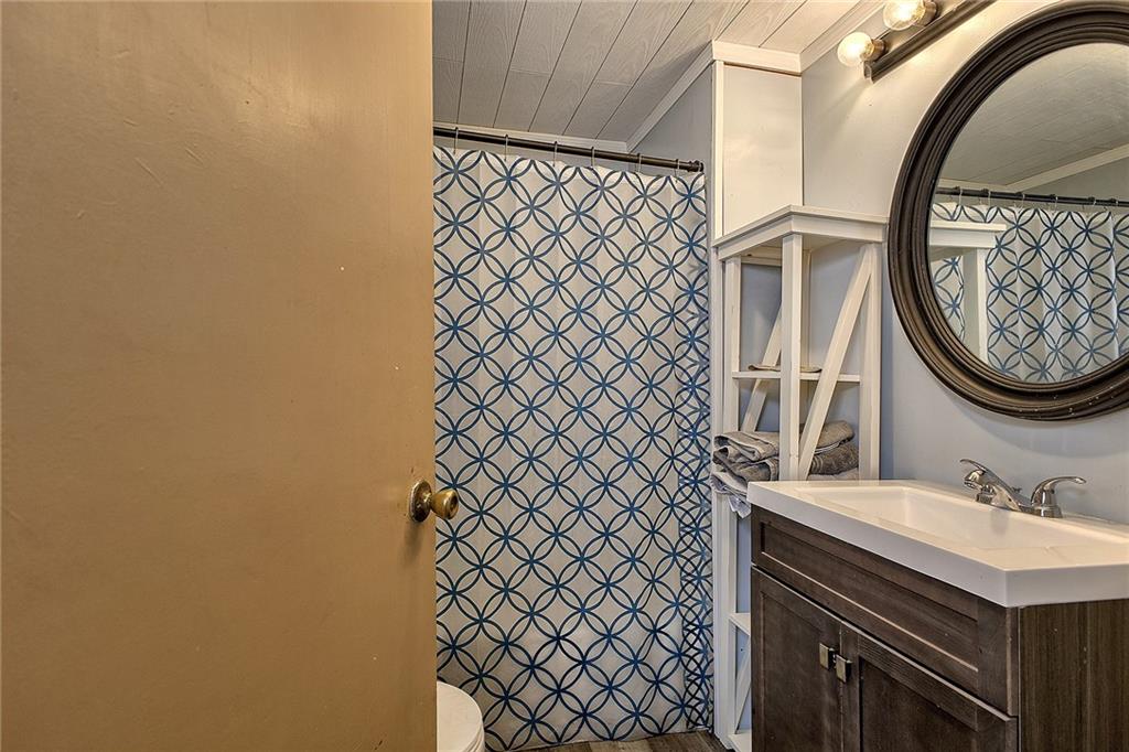 3456 Country Club Road Mount Pleasant, PA 15666 - Photo 23 of 39 a bathroom with a sink and a mirror