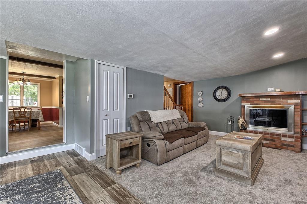 3456 Country Club Road Mount Pleasant, PA 15666 - Photo 29 of 39 a living room with furniture and a fireplace