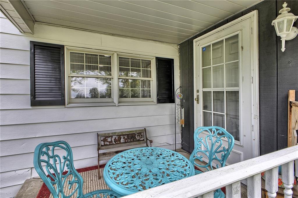 3456 Country Club Road Mount Pleasant, PA 15666 - Photo 5 of 39 a front view of a house with outdoor seating