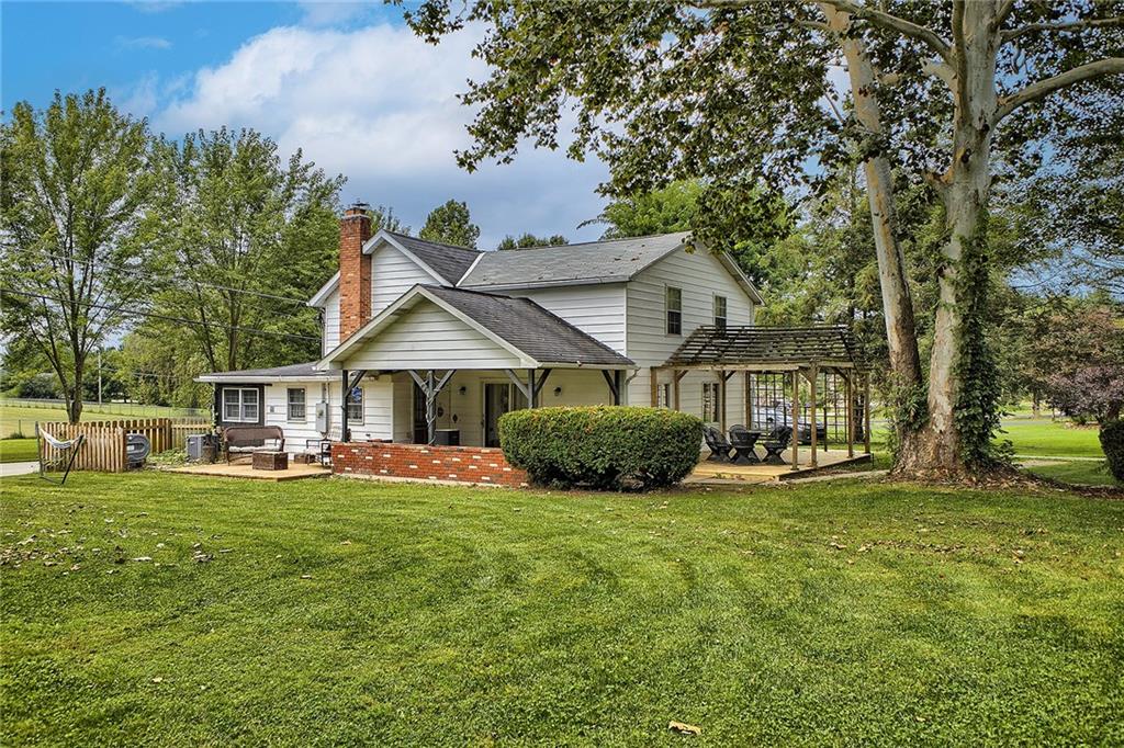3456 Country Club Road Mount Pleasant, PA 15666 - Photo 8 of 39 a view of a house with a big yard and large trees