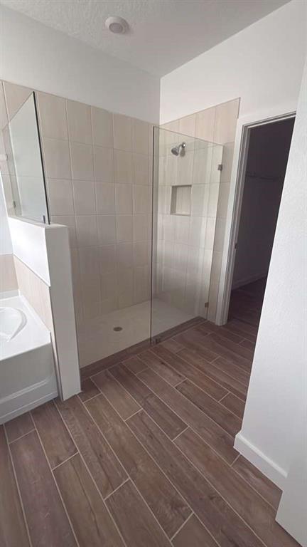 8780 Southwest Kanner Oaks Drive Stuart, FL 34997 - Photo 7 of 14 a view of a hallway with wooden floor and staircase