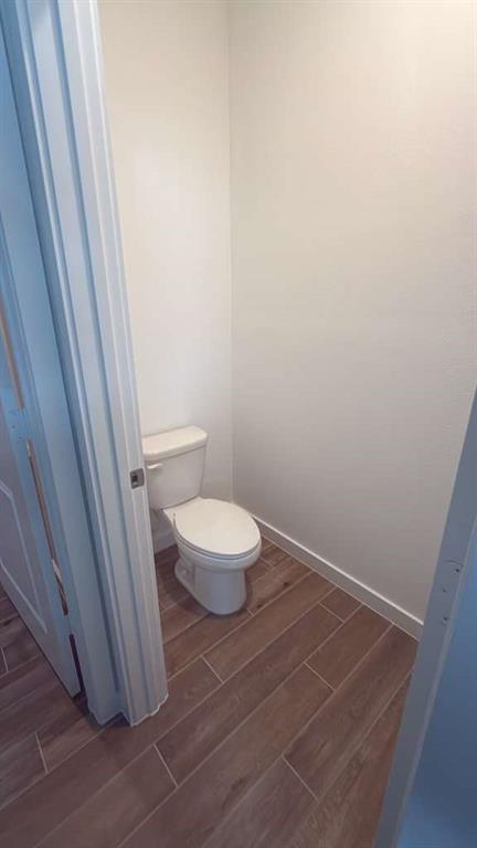 8780 Southwest Kanner Oaks Drive Stuart, FL 34997 - Photo 9 of 14 a bathroom with a toilet and a sink