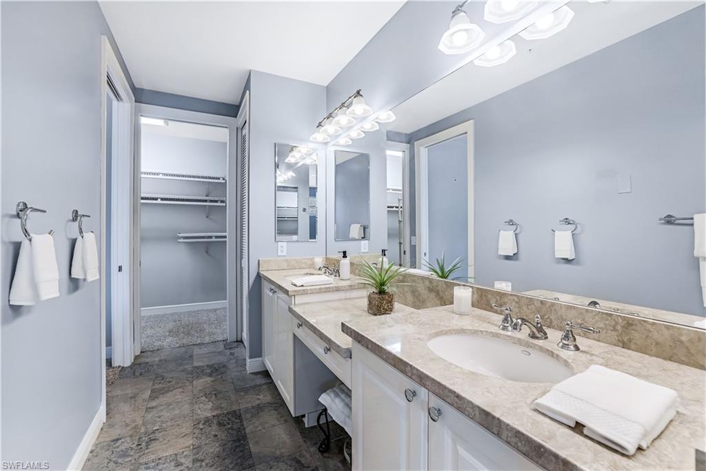 863 9th Avenue South, Unit 202 Naples, FL 34102 - Photo 18 of 35 a spacious bathroom with a double vanity sink mirror and double
