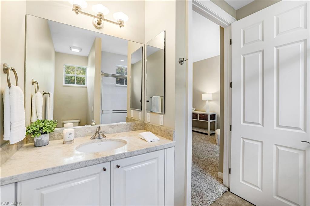 863 9th Avenue South, Unit 202 Naples, FL 34102 - Photo 22 of 35 a bathroom with a sink and a mirror