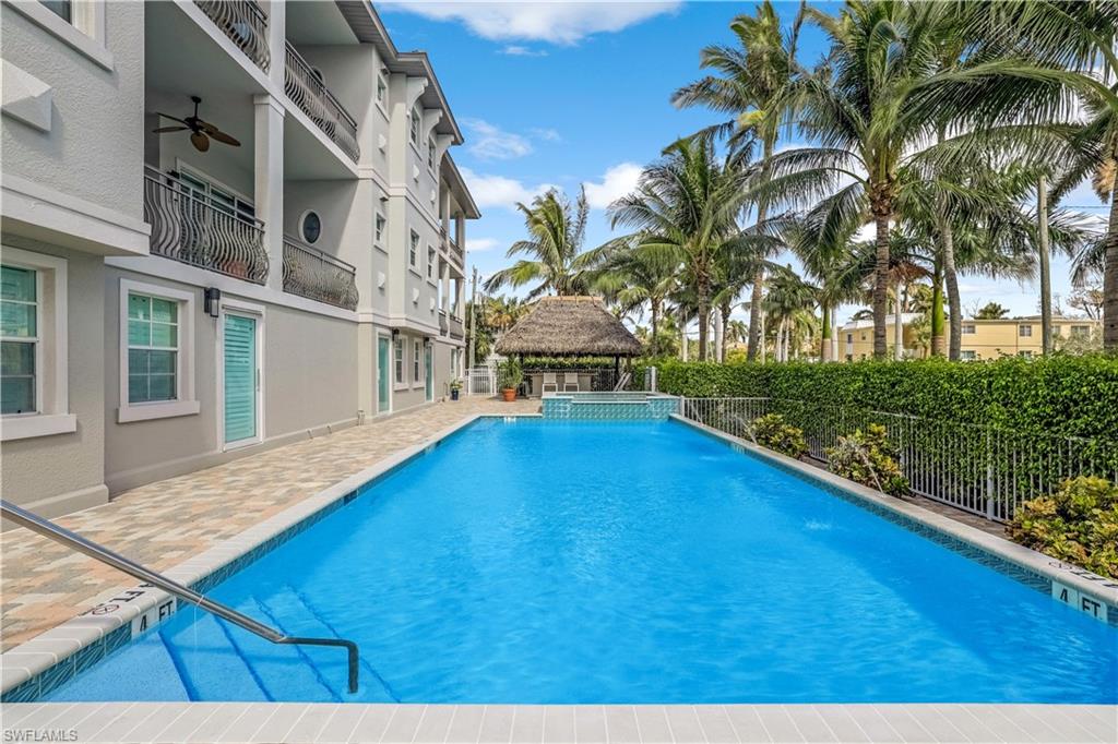 863 9th Avenue South, Unit 202 Naples, FL 34102 - Photo 32 of 35 a view of swimming pool with a yard