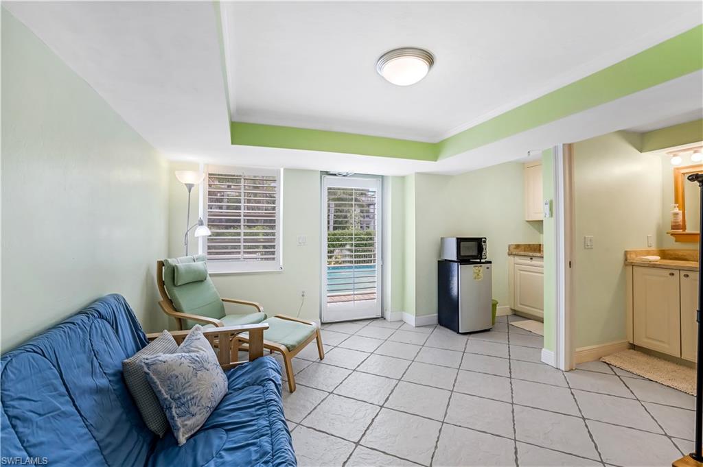863 9th Avenue South, Unit 202 Naples, FL 34102 - Photo 33 of 35 a living room with furniture and a window