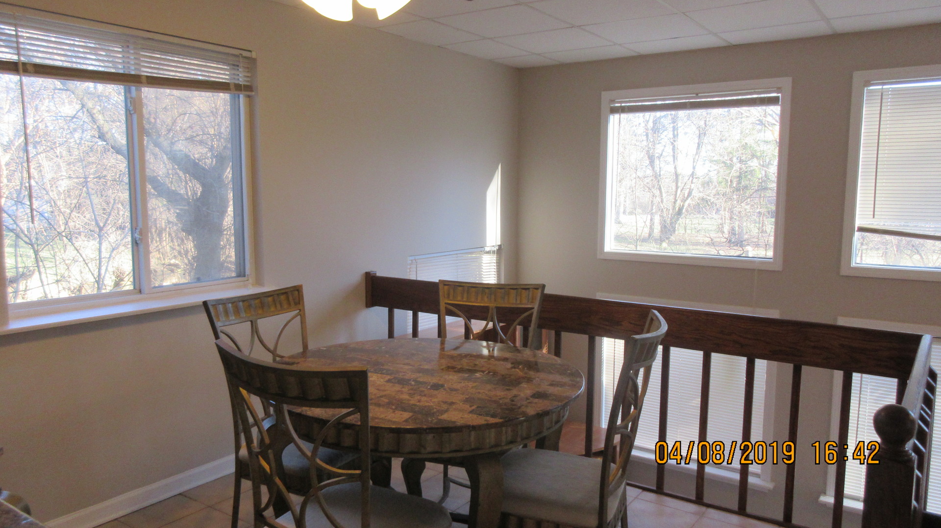 28W753 Roosevelt Road West Chicago, IL 60185 - Photo 11 of 17 a view of a dining room with furniture and window