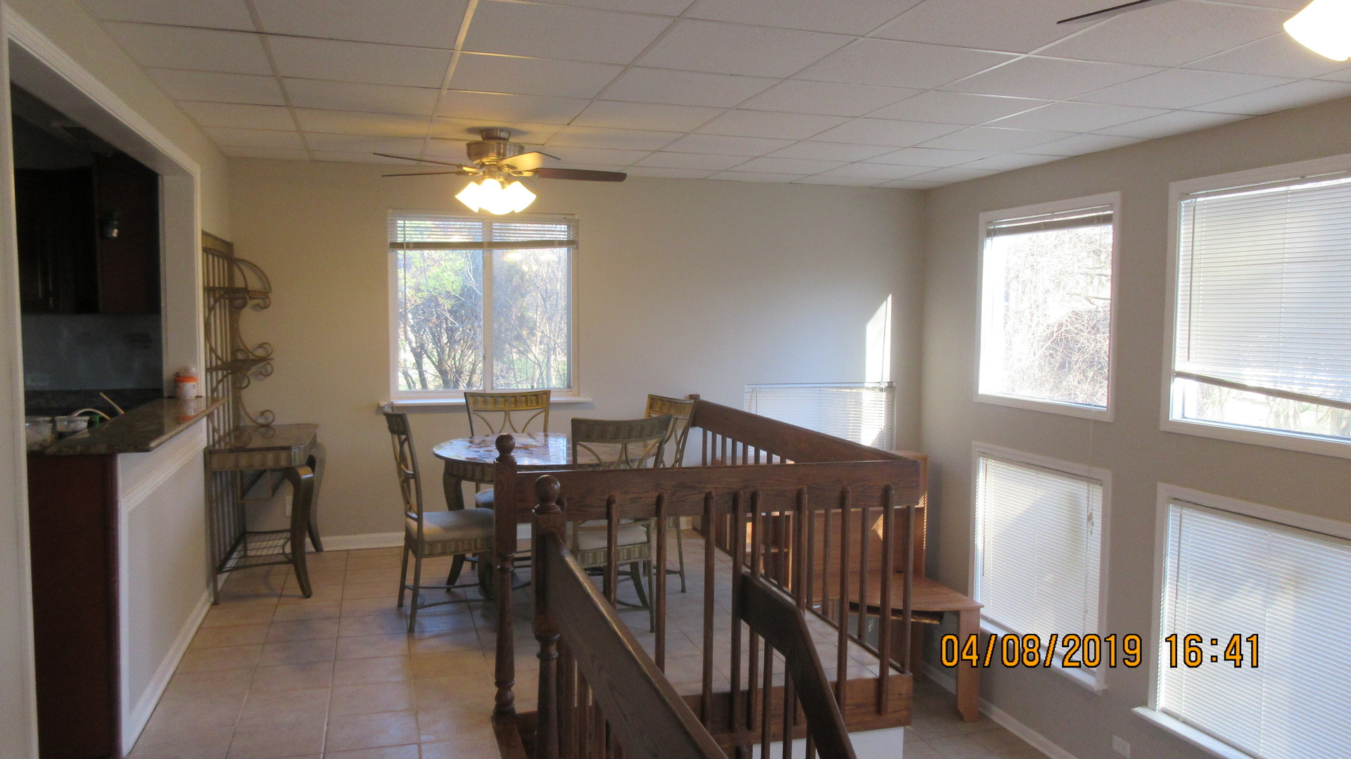 28W753 Roosevelt Road West Chicago, IL 60185 - Photo 14 of 17 a view of a dining room with furniture window and wooden floor
