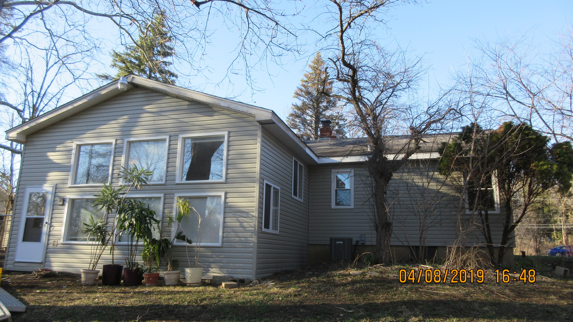 28W753 Roosevelt Road West Chicago, IL 60185 - Photo 16 of 17 a front view of a house with a yard