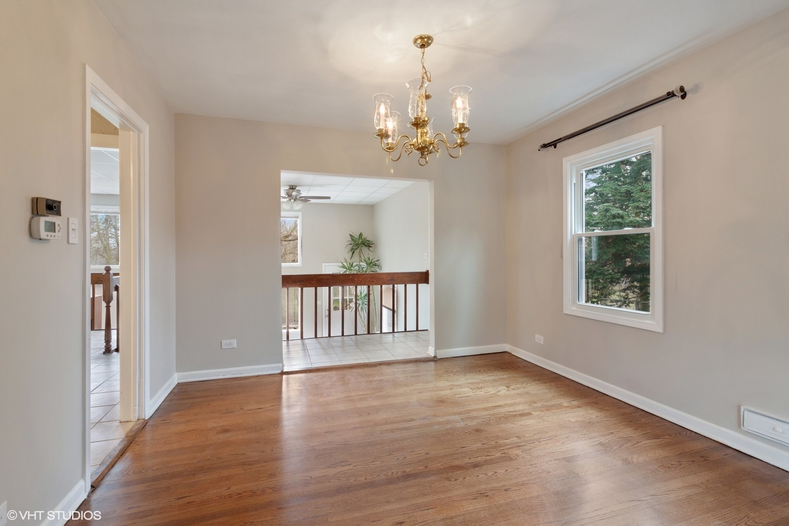 28W753 Roosevelt Road West Chicago, IL 60185 - Photo 3 of 17 an empty room with wooden floor and windows