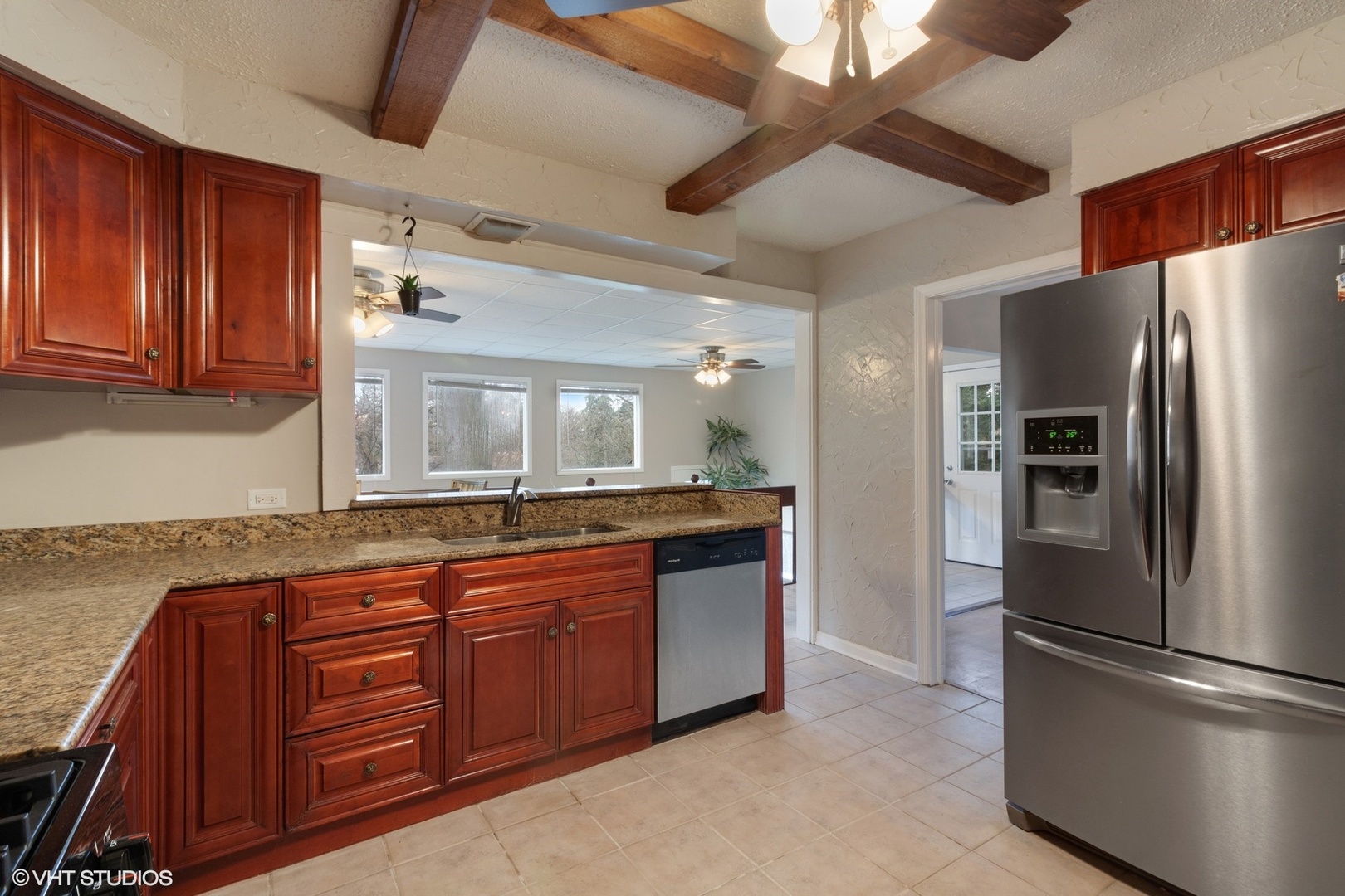 28W753 Roosevelt Road West Chicago, IL 60185 - Photo 5 of 17 a kitchen with stainless steel appliances granite countertop a refrigerator a sink and dishwasher