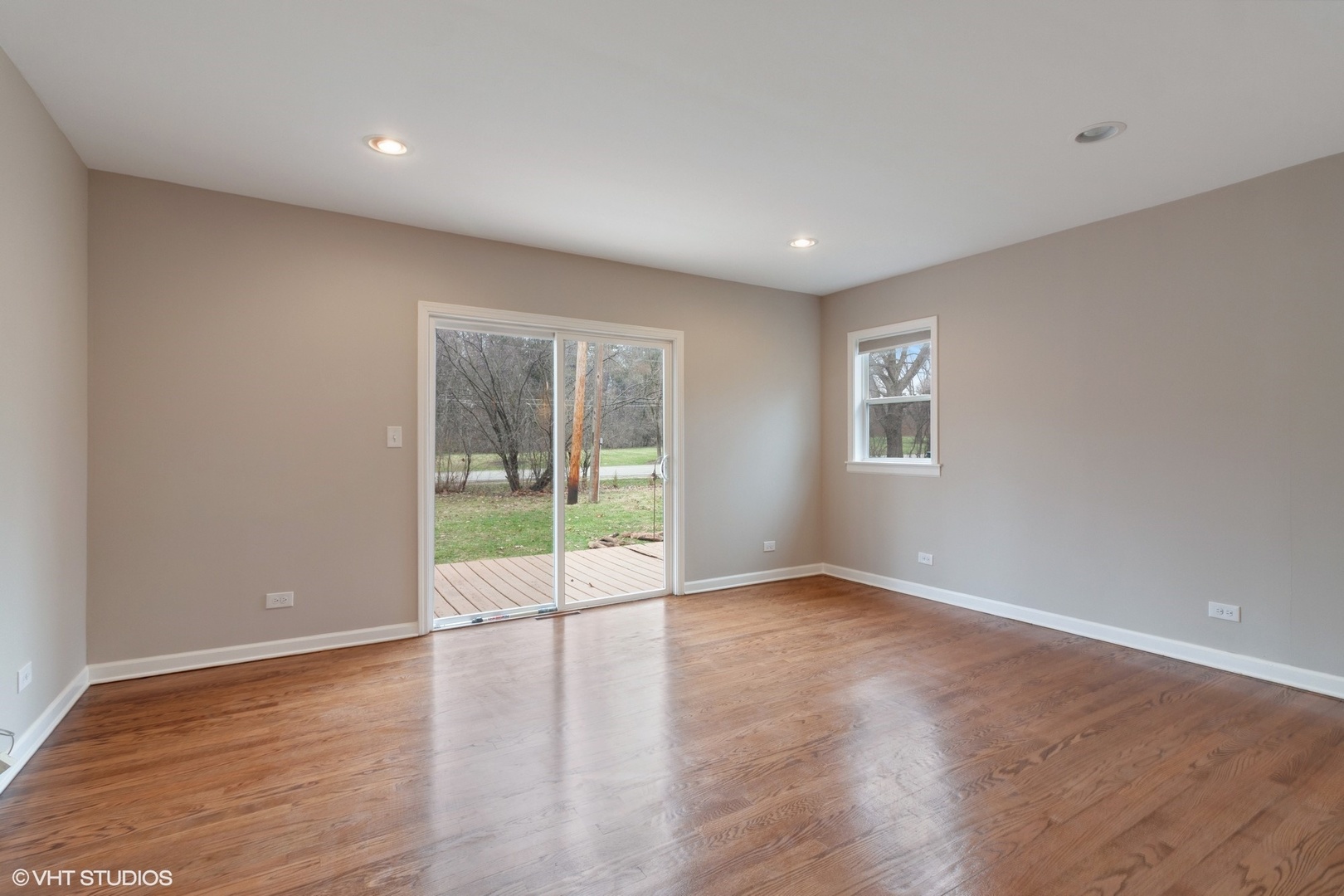 28W753 Roosevelt Road West Chicago, IL 60185 - Photo 7 of 17 a view of an empty room with wooden floor and a window