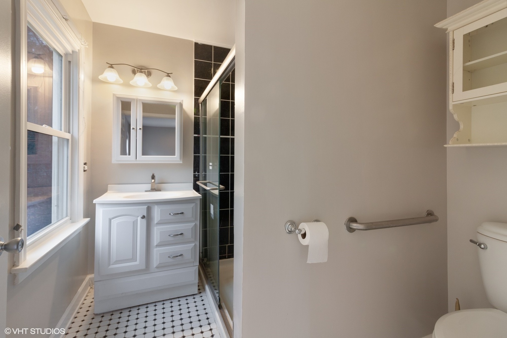 28W753 Roosevelt Road West Chicago, IL 60185 - Photo 8 of 17 a bathroom with a sink a toilet and shower