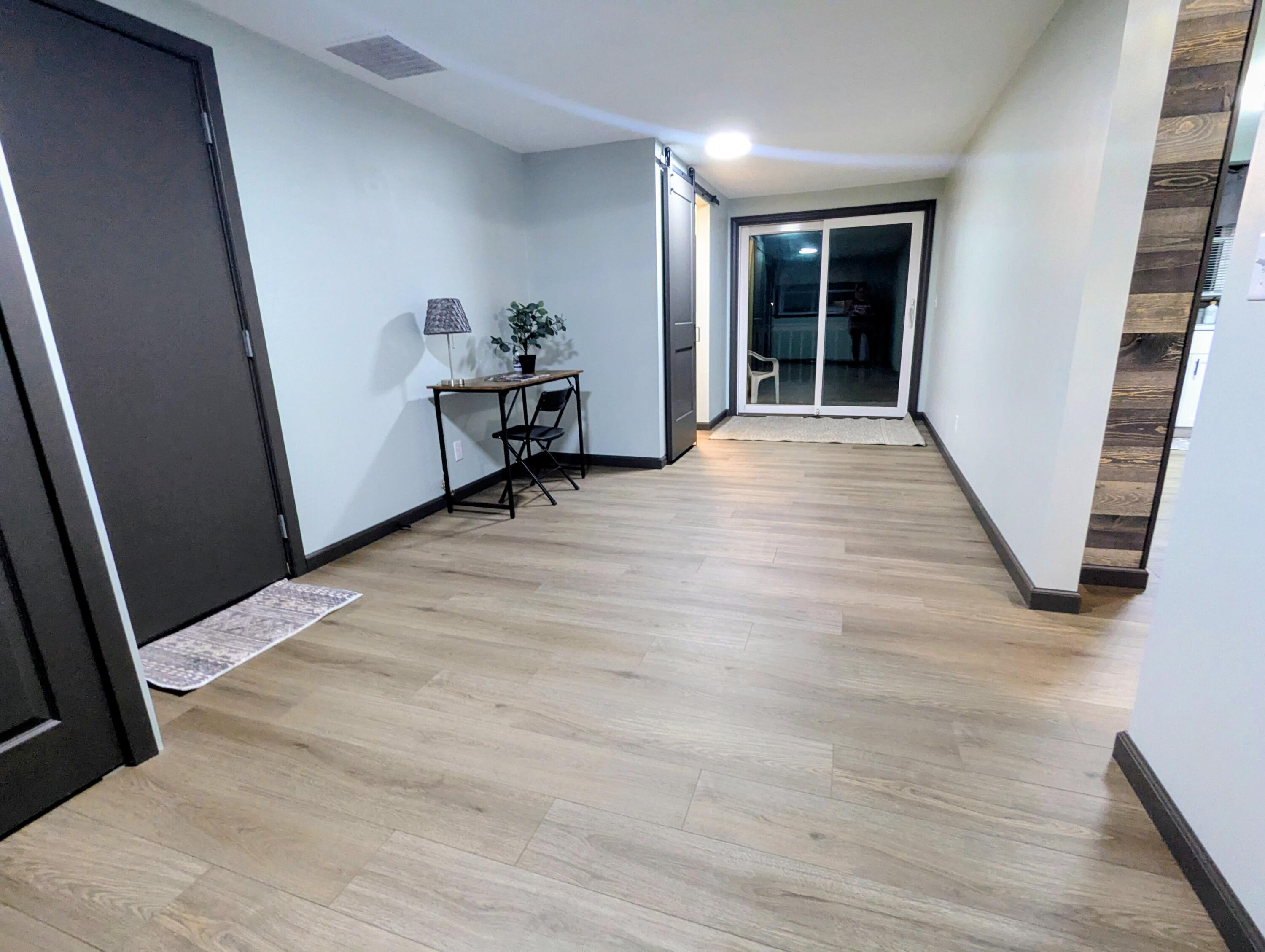 521 Ryan Road Hebron, IN 46341 - Photo 12 of 25 a view of an empty room with wooden floor and stairs
