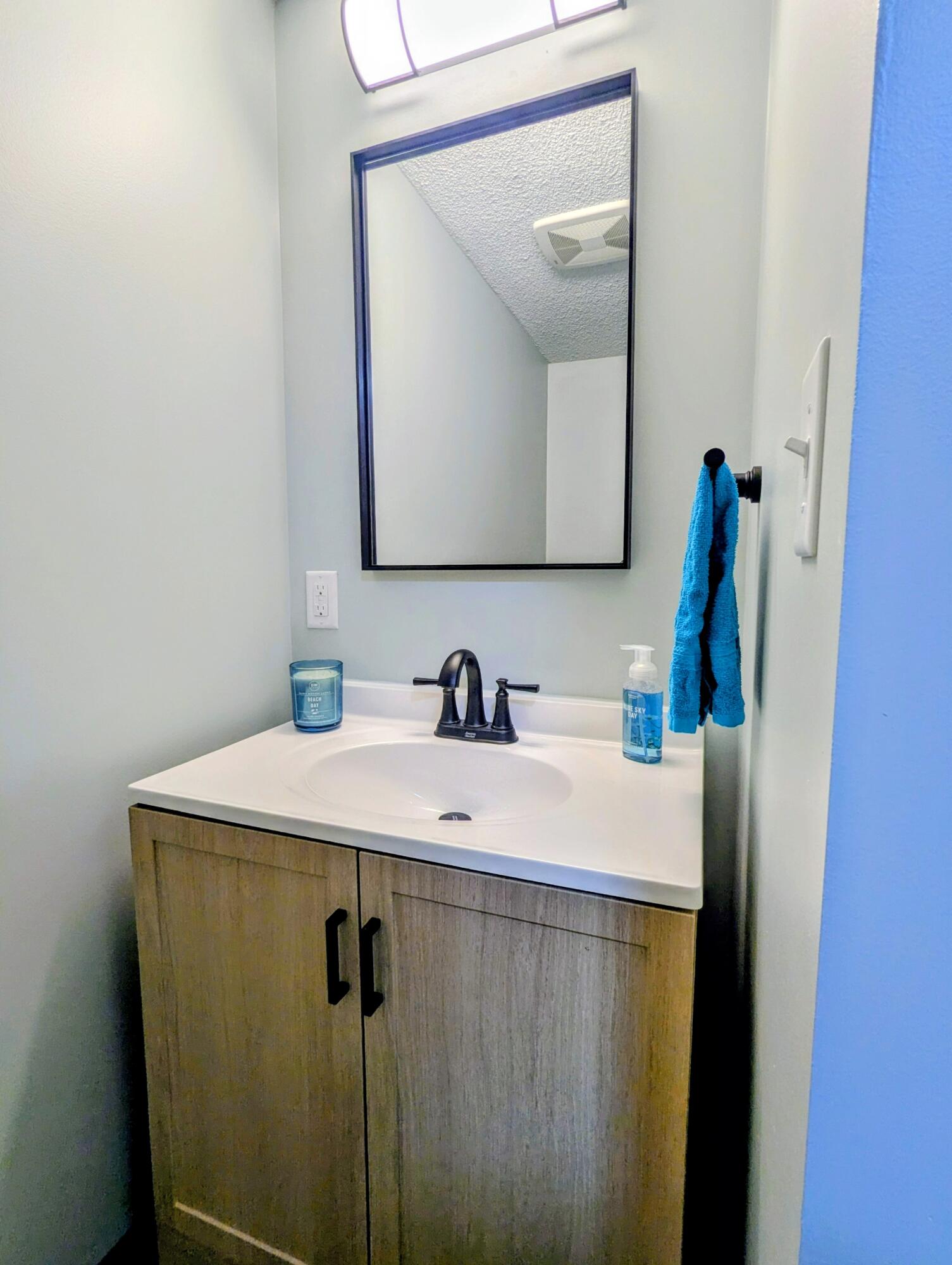 521 Ryan Road Hebron, IN 46341 - Photo 13 of 25 a bathroom with a sink and a mirror
